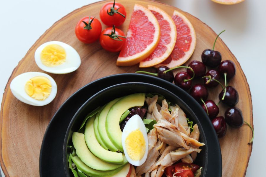 A plate full of nutrition food on wooden table
